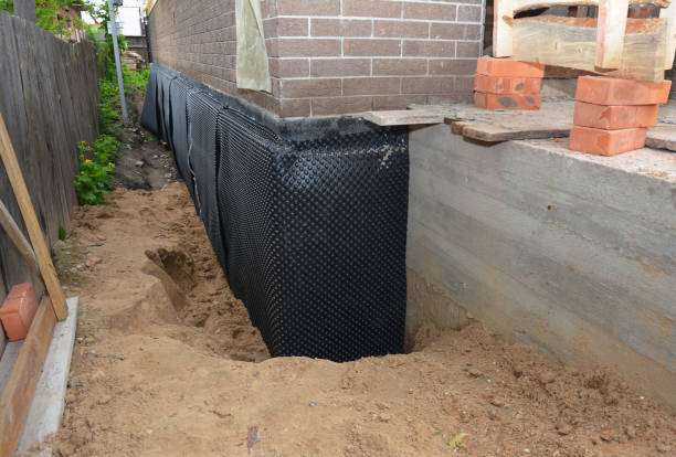 Happy homeowners after waterproofing job in Maryville